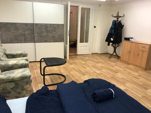 a living room with a couch and a chair at Old Town Apartments R11 in Olomouc