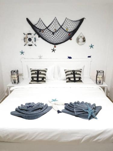 a bedroom with a bed with two towels on it at Phi Phi Indigo Hotel in Phi Phi Don
