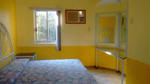 Postel nebo postele na pokoji v ubytování HOTEL POSADA MONTSERRAT