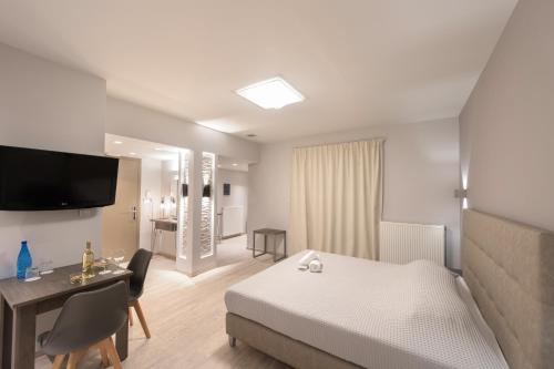 Ένα ή περισσότερα κρεβάτια σε δωμάτιο στο Castello Hotel