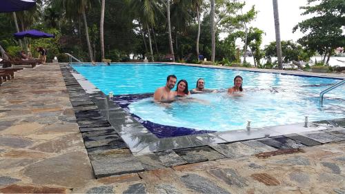 a group of people in a swimming pool at Riviera Resort in Batticaloa