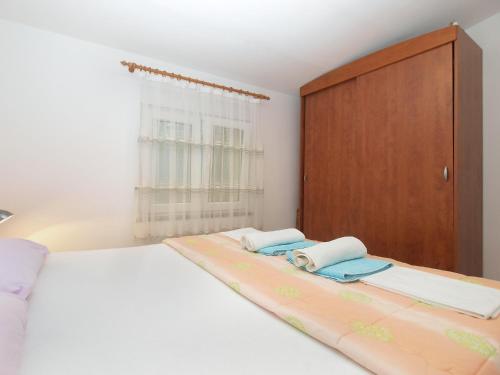 Postel nebo postele na pokoji v ubytování Apartments Milovan 1774