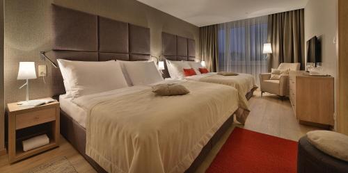 Voodi või voodid majutusasutuse Apollo Hotel Bratislava toas