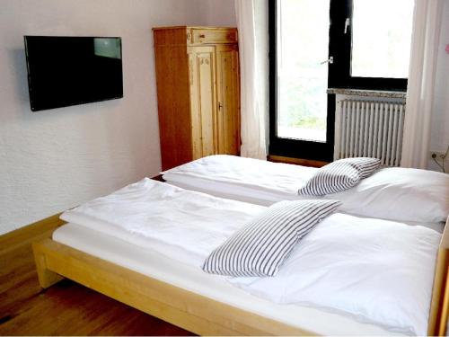 Ένα ή περισσότερα κρεβάτια σε δωμάτιο στο Ferienhaus Mauth