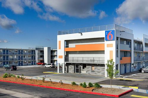 a building with a parking lot in front of it at Motel 6- Denver, CO Downtown in Denver