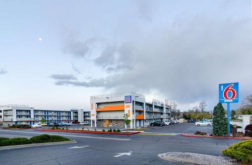 a parking lot in front of a large building at Motel 6- Denver, CO Downtown in Denver