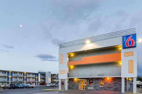 a building with a gas station in a parking lot at Motel 6- Denver, CO Downtown in Denver
