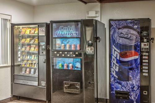 two soda machines in a room with drinks at Motel 6-Dallas, TX - Northwest in Dallas