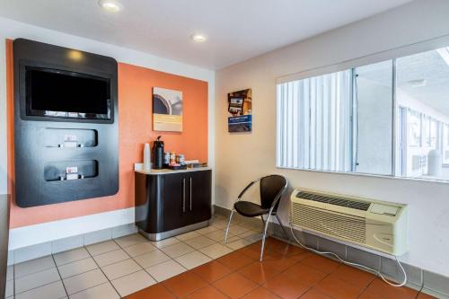 a room with a fan and a tv on a wall at Motel 6-El Centro, CA in El Centro