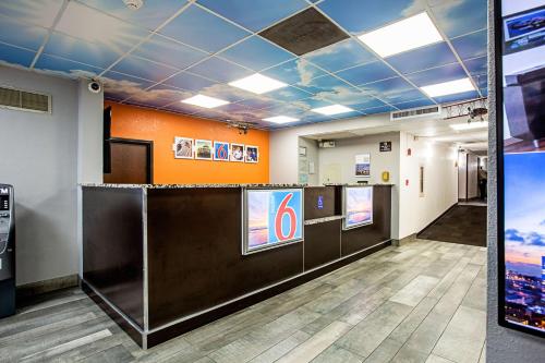 a lobby with a reception desk in a building at Motel 6 Atlanta GA Atlanta Airport Virginia Ave in Atlanta