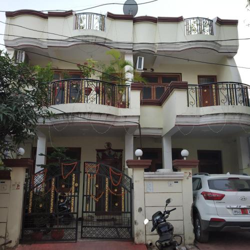 a scooter parked in front of a house at Pratibha Home stay in Jabalpur