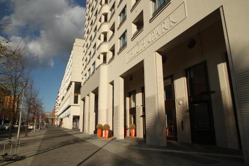 a building on a street with orange cones in front of it at HighPark Berlin am Potsdamer Platz in Berlin