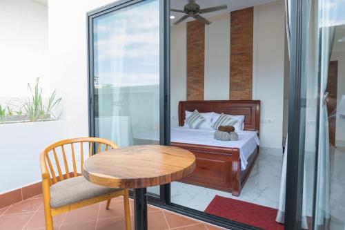 Postel nebo postele na pokoji v ubytování Siemreap City Residence