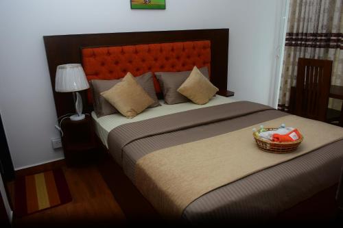 Ένα ή περισσότερα κρεβάτια σε δωμάτιο στο Shinic Holiday Inn