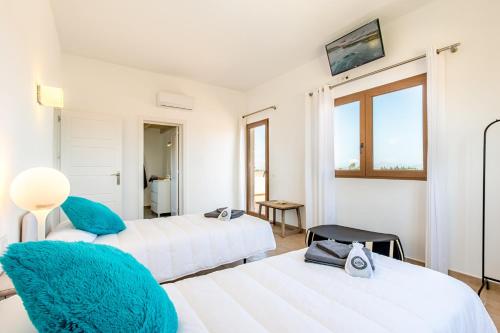 Llit o llits en una habitació de Villa Can Turquesa / Casa Turquesa