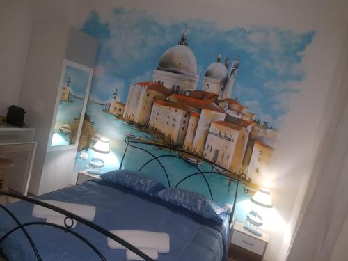 a bedroom with a castle mural on the wall at Bed Rho Stazione - Fiera in Rho