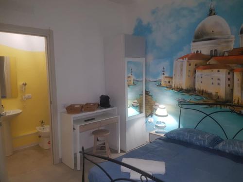 a bedroom with a mural of a city on the wall at Bed Rho Stazione - Fiera in Rho