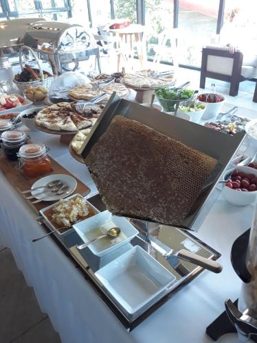 a buffet of food on a table at Savaneti Eco Hotel in Tʼelavi
