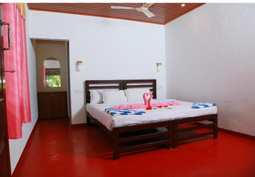 Postel nebo postele na pokoji v ubytování Marari Adonis Beach Villa