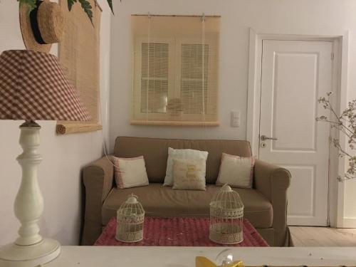 a living room with a couch and a window at Lisbon Cozy House w/Garden and Pool in Valejas