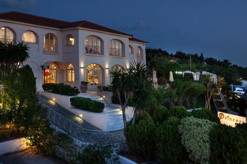 a large house with lights in front of it at Princess Hotel in Lassi