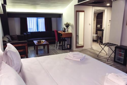 Ένα ή περισσότερα κρεβάτια σε δωμάτιο στο Tymbris Hotel Eskisehir