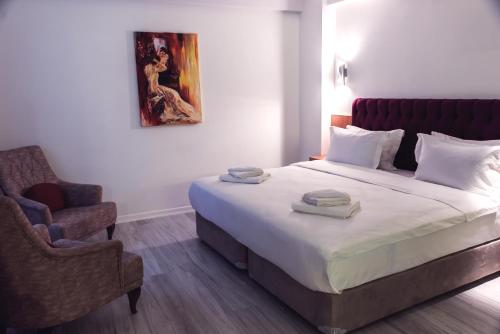 Ένα ή περισσότερα κρεβάτια σε δωμάτιο στο Tymbris Hotel Eskisehir