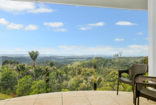 a view from the balcony of a house at Waitakere Resort & Spa in Auckland