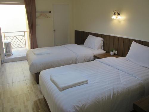 Letto o letti in una camera di Baan Wanchart
