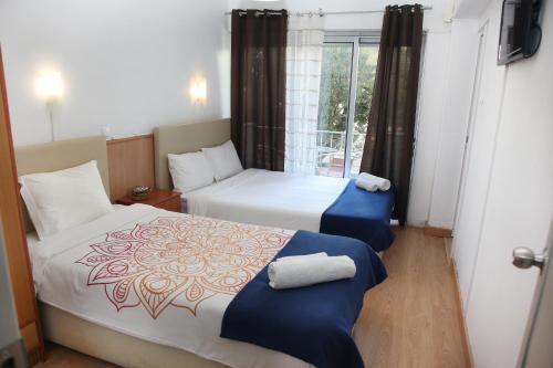 Cama o camas de una habitación en Lisbon Suite Home