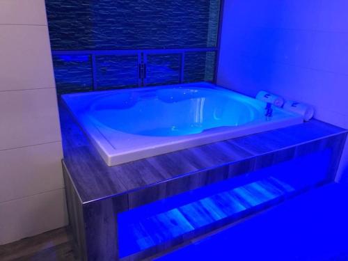 a bath tub with blue lighting in a bathroom at Hotel Plaza Arteaga in Monterrey