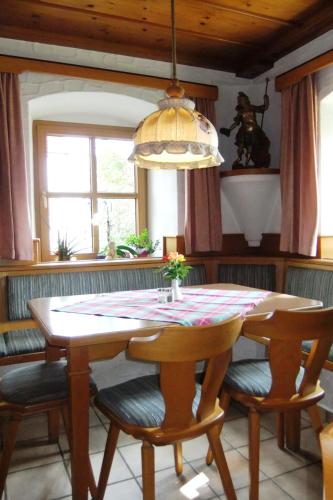 a dining room with a table and some chairs at Gasthaus zum Stausee in Grafenau