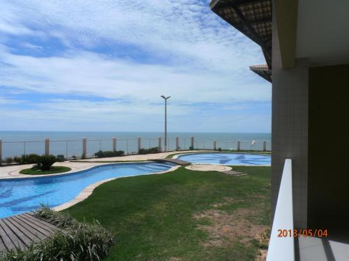 Bazén v ubytování Apart Canoa Quebrada nebo v jeho okolí