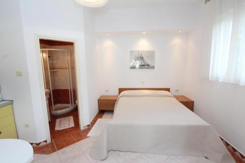 Säng eller sängar i ett rum på Apartments Villa Buric