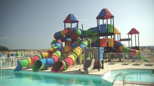 a water park with a colorful water slide at Appartamento Guido Reni in Lido di Spina