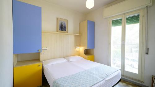 A bed or beds in a room at Appartamento Guido Reni