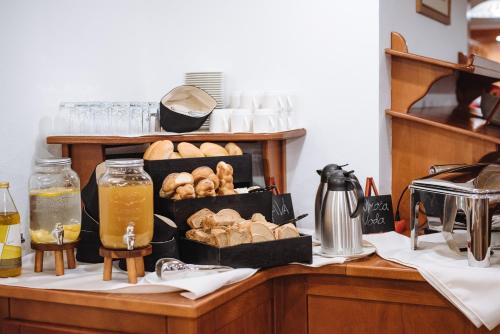 a table with a bunch of pastries on it at Bed & Breakfast Reaktiv in Zreče