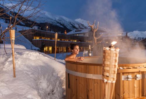 L'établissement Relais & Châteaux IN LAIN Hotel Cadonau en hiver