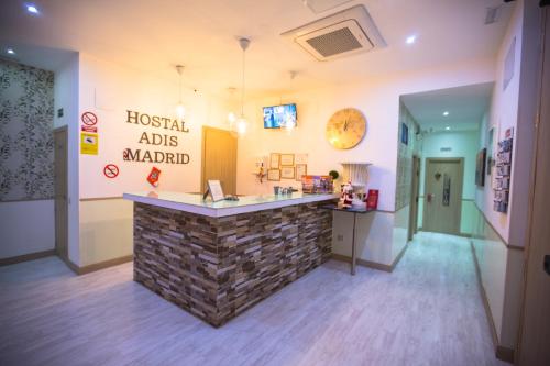 a lobby of a hospital with a stone counter at Hostal Adis in Madrid