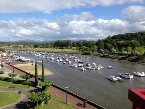 a bunch of boats are docked in a river at nivelle in Saint-Jean-de-Luz