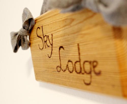 a piece of wood with the word dance written on it at Appartementhaus Sky Lodge in Altenmarkt im Pongau