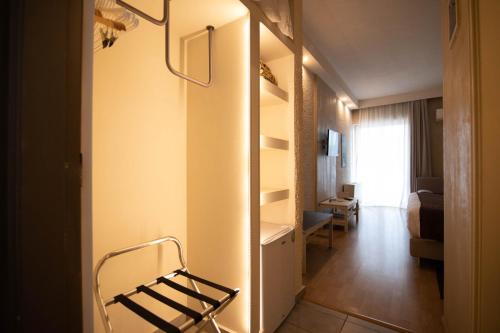 a room with a hallway with a chair in it at Nidimos Hotel in Delfoi