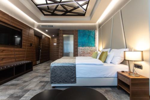 Postel nebo postele na pokoji v ubytování Artis Boutique Hotel