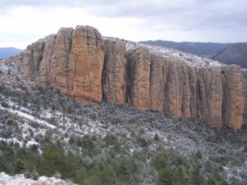 a large rock formation with snow on top of it at Casa rural Rosa in La Fresneda