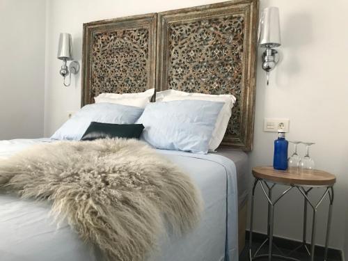 מיטה או מיטות בחדר ב-Apartamento Azure- Tierra y Mar