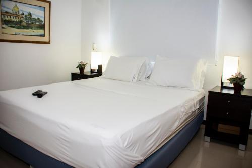 A bed or beds in a room at Mirador del Laguito 1201