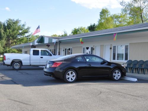 a black car parked in front of a building at Gorgeous View Motel in Watkins Glen