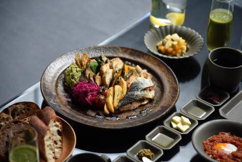 a table with a plate of food on a table at MOGANA in Kyoto