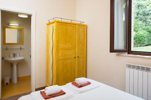 Ένα ή περισσότερα κρεβάτια σε δωμάτιο στο Borgo Sorbatti
