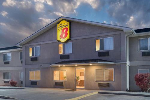 a building with a sign on the side of it at Super 8 by Wyndham Fountain in Fountain